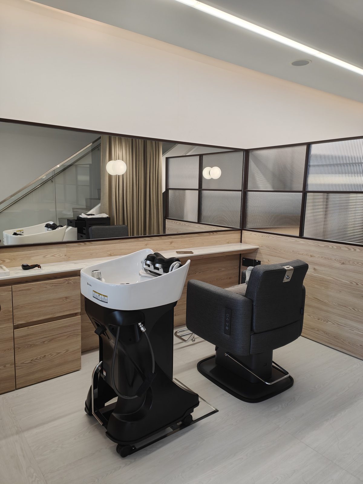 The wash basins in pale wood
